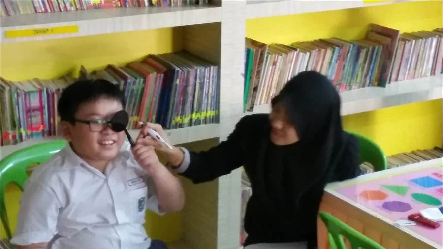 Student getting an eye exam from Eyecon