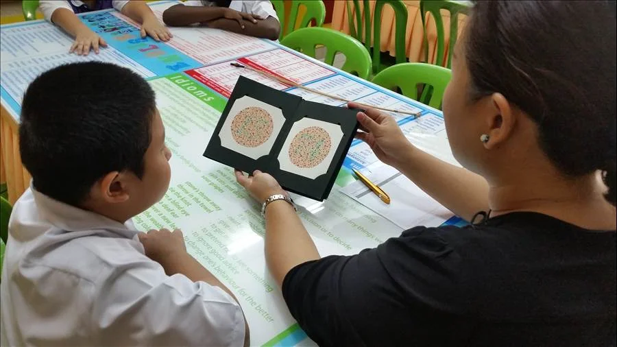 Student getting an eye exam from Eyecon